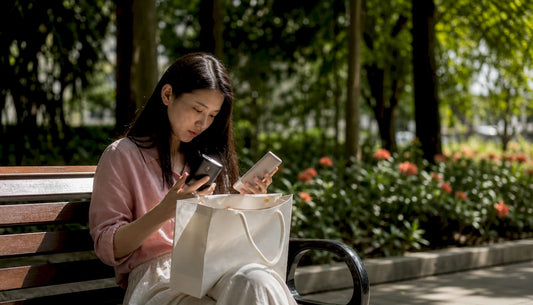 Shopper inspecting discount gadget in electronics store