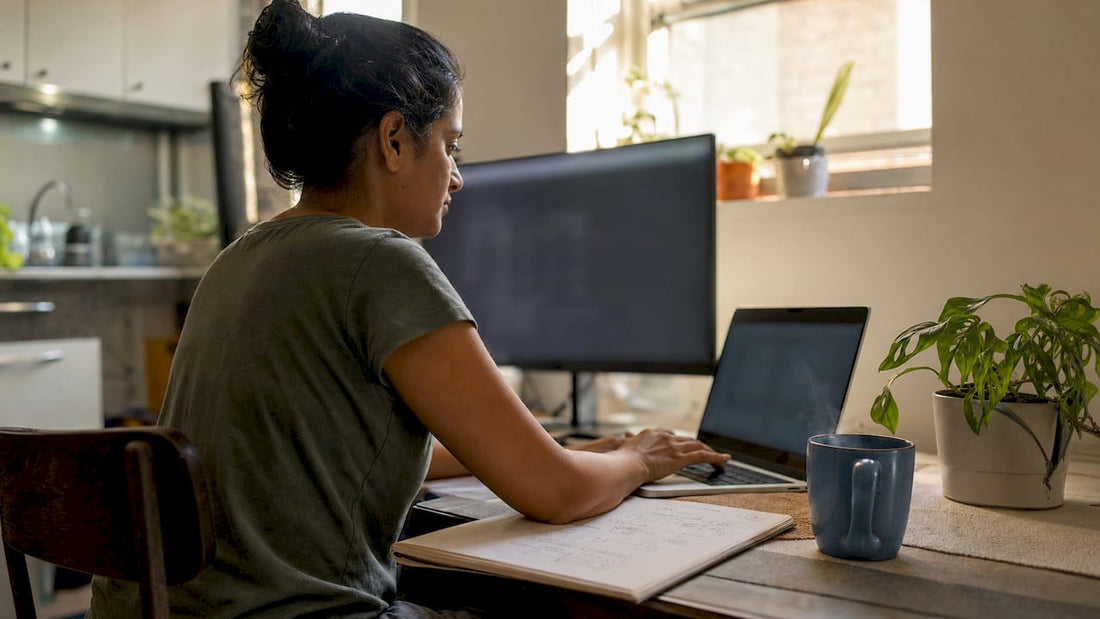Woman typing software commands at home desk
