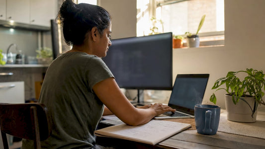 Woman typing software commands at home desk